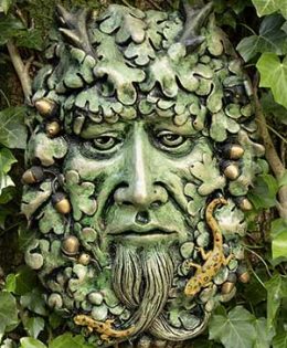 4.  Puck Green Man Sculpture: forest green finish